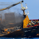 Smoke billows from the container ship MV X-Press Pearl which carries hundreds of containers of chemicals and plastics, as it's towed away from the coast of Colombo.